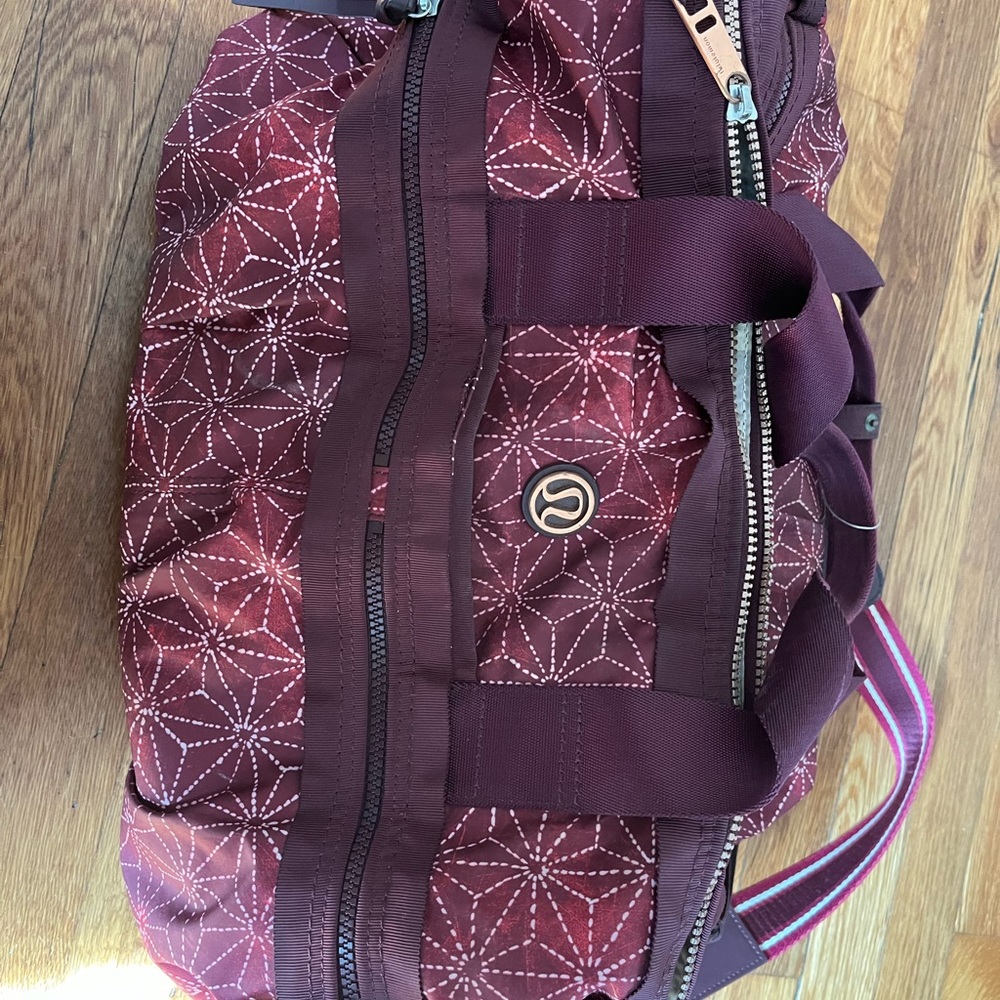 Lululemon Athletica Red Travel Bag with Geometric Pattern